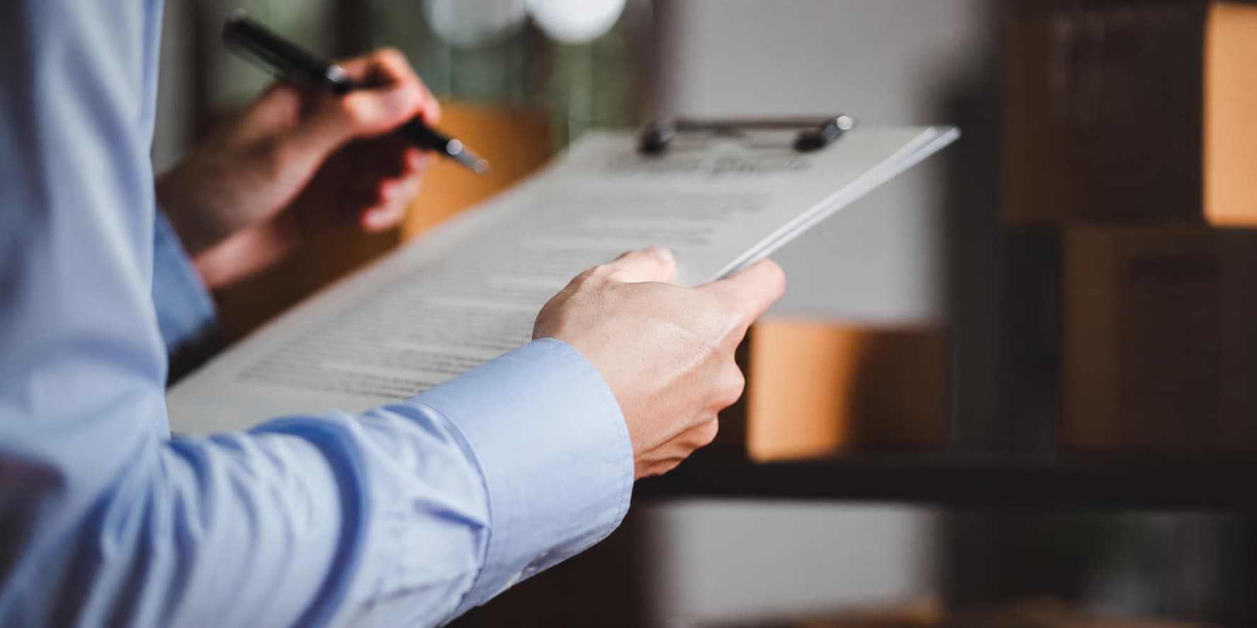 Investigator reviewing a case document on a clipboard